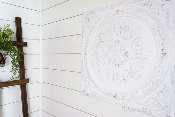 I'm revealing our small bathroom that we made over with products provided by Lowe's to add big farmhouse style! Come see it at DIY beautify! #farmhouse #bathroom #roommakeover #Lowes shiplap walls and farmhouse display ladder